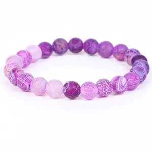 Macro view of purple dragon vein agate beads on a flexible bracelet.