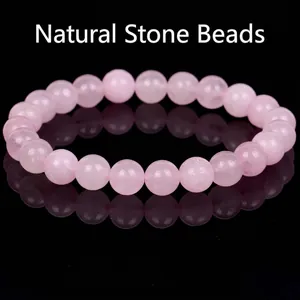 Close-up view of natural pink rose quartz gemstone beads bracelet for jewelry detail