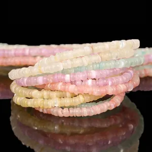 Close-up detail of 3mm natural shell heishi disk beads for DIY jewelry