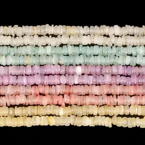 Macro view showing the texture of 3mm natural white shell heishi beads in various pastel colors.