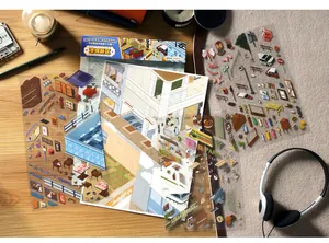 Detail view of Infeel.Me miniature scene stickers spread on a wooden desk for creative DIY crafts