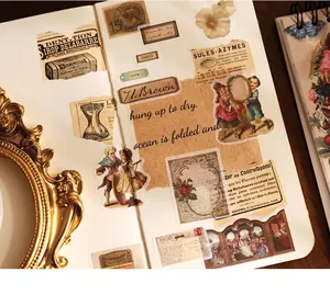 Detailed view of vintage European stickers applied on a creative DIY scrapbook page