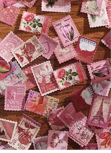 Close-up of vintage floral and animal themed stamp stickers for scrapbooking