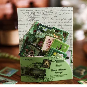 Close-up of vintage Forest Whisper postage stamp stickers set for scrapbooking and DIY decoration