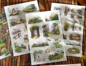 Detailed view of vintage landscape and animal themed die-cut sticker sheets for journaling