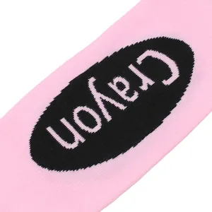 Close-up detail showing the knit texture and Crayon print of these pink knee-high socks