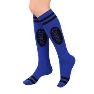 Close-up view of blue crayon knee-high socks featuring black stripes and word print