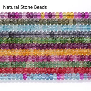 Detailed view of colorful 5x8mm crystal abacus beads arranged in neat rows