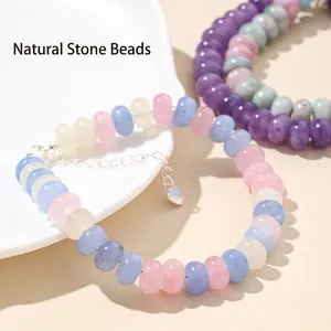 Detailed shot of 5x8mm abacus-shaped natural morganite and crystal bead bracelet