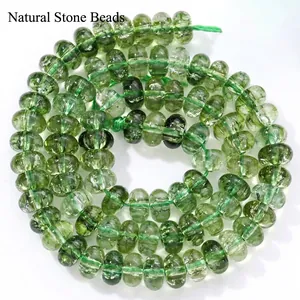 Detailed macro view of 5x8mm green crystal abacus beads for DIY jewelry making