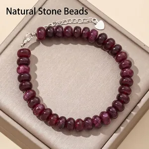Close-up detail of 5x8mm dark red abacus gemstone beads bracelet with silver clasp