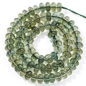 Detailed view of translucent green 5x8mm abacus crystal beads for jewelry making