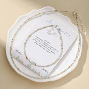 Macro detail of faceted natural stone beads on a minimalist necklace and anklet set
