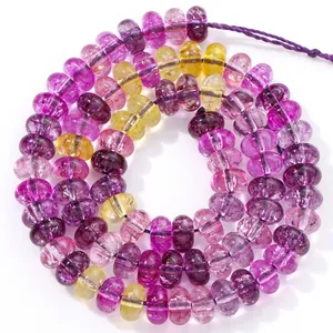 Detail view of 5x8mm translucent purple and yellow crystal abacus beads for jewelry making