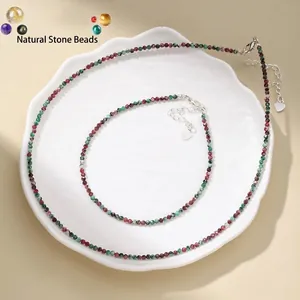 Elegant faceted natural stone bead necklace and anklet jewelry set on white plate