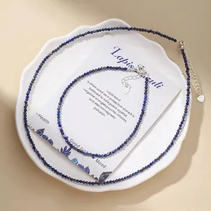 Detail of faceted lapis lazuli bead necklace and anklet set with heart charms