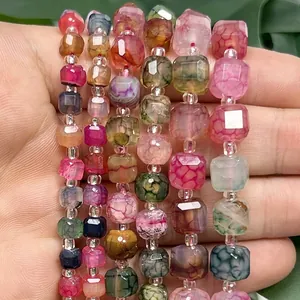 Close-up detail of faceted colorful dragon vein cube beads for DIY jewelry making.