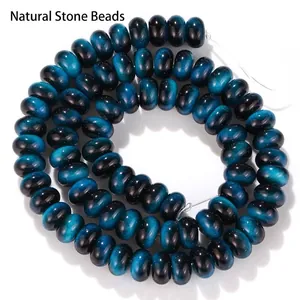 Close-up of blue tiger eye glass abacus beads showing glossy cat-eye effect