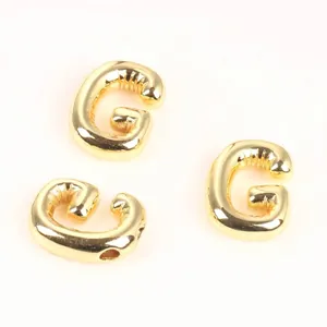 Detail of 20mm gold copper alphabet beads letter G for DIY jewelry making