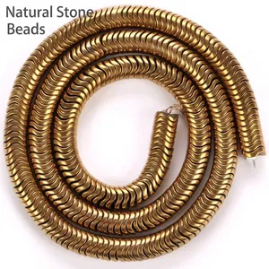 Vue détaillée d'intercalaires en hématite dorée de 6mm pour la création de bijoux.