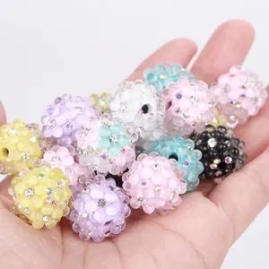 Detailed view of colorful bubble beads with rhinestones for DIY jewelry making