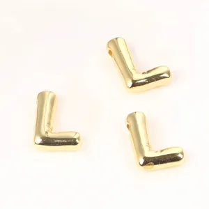 Detailed view of 20mm golden copper alphabet letter L beads for DIY necklace bracelets