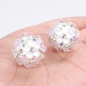 Macro view of white crystal bubble beads with colorful rhinestones for DIY jewelry making