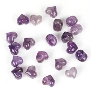 Macro detail of 13mm purple amethyst heart-shaped natural stone beads for DIY jewelry making