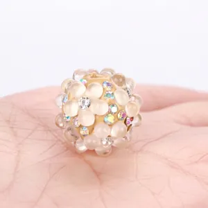 Close-up of a colorful crystal bubble bead with sparkling rhinestones for DIY jewelry