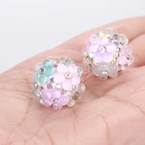 Detail view of colorful floral bubble beads with rhinestones for DIY jewelry making