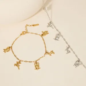 Elegant stainless steel charm bracelet featuring cat, owl, and horse animal pendants