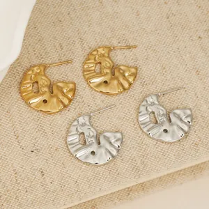 Stylish irregular liquid metal hoop earrings made of gold and silver stainless steel