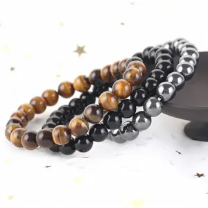 Set di tre braccialetti con perline in pietra naturale: occhio di tigre, onice ed ematite