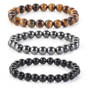 Set di tre braccialetti in perline di pietra naturale con occhio di tigre ed onice