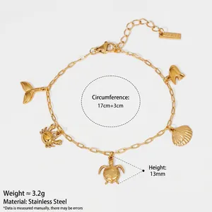 Exquisite gold stainless steel ocean charm bracelet featuring turtle and shell pendants