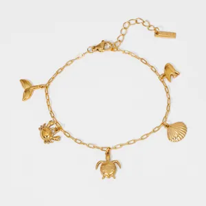 Gold-plated stainless steel bracelet with ocean charms like turtle and shell