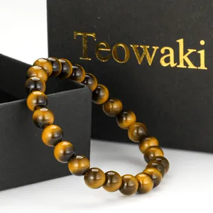 Detailed close-up showing the glossy texture of tiger eye imitation glass beads