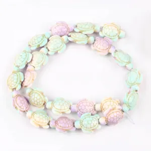 Detailed view of colorful turtle-shaped synthetic turquoise beads for DIY jewelry