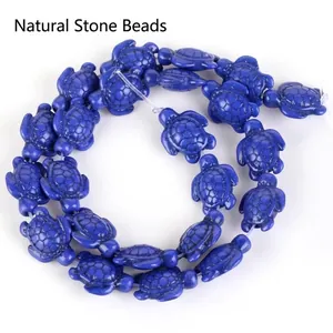 Detailed view of blue synthetic turquoise turtle-shaped beads for DIY jewelry