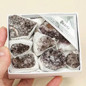 Natural smoky quartz crystal clusters in a white gift box with mineral label.