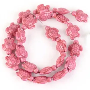 Detailed view of pink turtle-shaped synthetic turquoise beads for DIY jewelry making