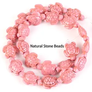 Detail shot of pink turtle-shaped synthetic turquoise beads for DIY jewelry making.