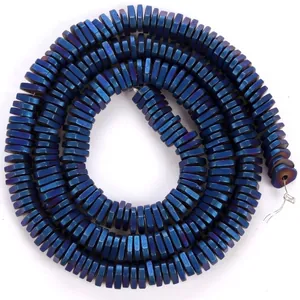 Close-up view of metallic blue electroplated triangular hematite beads for DIY jewelry