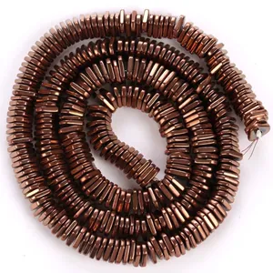 Detail view of copper-plated triangle hematite spacers for DIY jewelry making