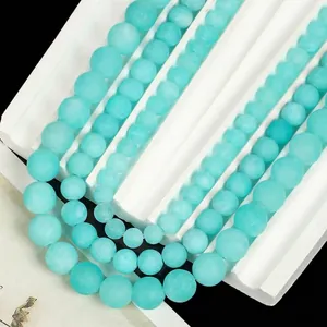 Detailed view of frosted light blue Amazonite round beads for DIY jewelry making craft.