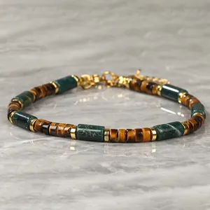 Close-up of bohemian natural stone bracelet with tiger eye and green agate beads