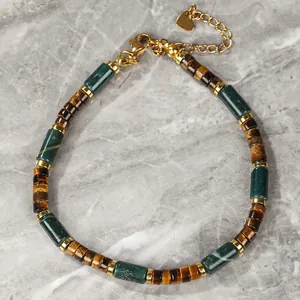 Close-up of natural tiger's eye and green Indian agate beaded bracelet with gold accents