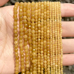 Macro view of faceted yellow natural stone beads in 2mm 3mm 4mm sizes for DIY crafts.