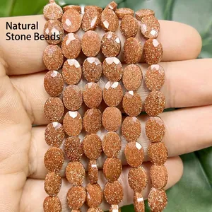 Macro view of faceted 6x8mm reddish-brown oval goldstone beads for jewelry
