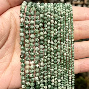 Macro view of multi-size green faceted natural stone beads for DIY jewelry making projects